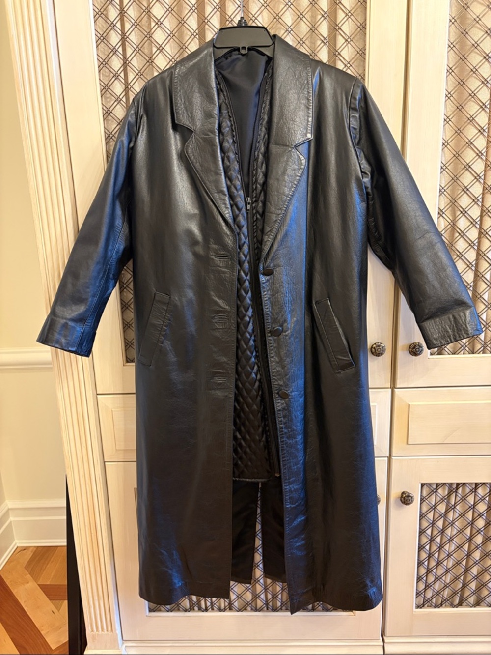 1990s vintage Women’s Black Leather Trench Coat with Quilted Interior.